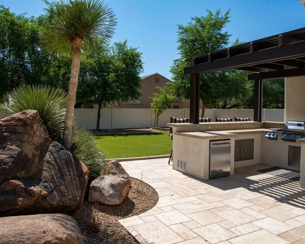 Paver patio with pergola and outdoor kitchen