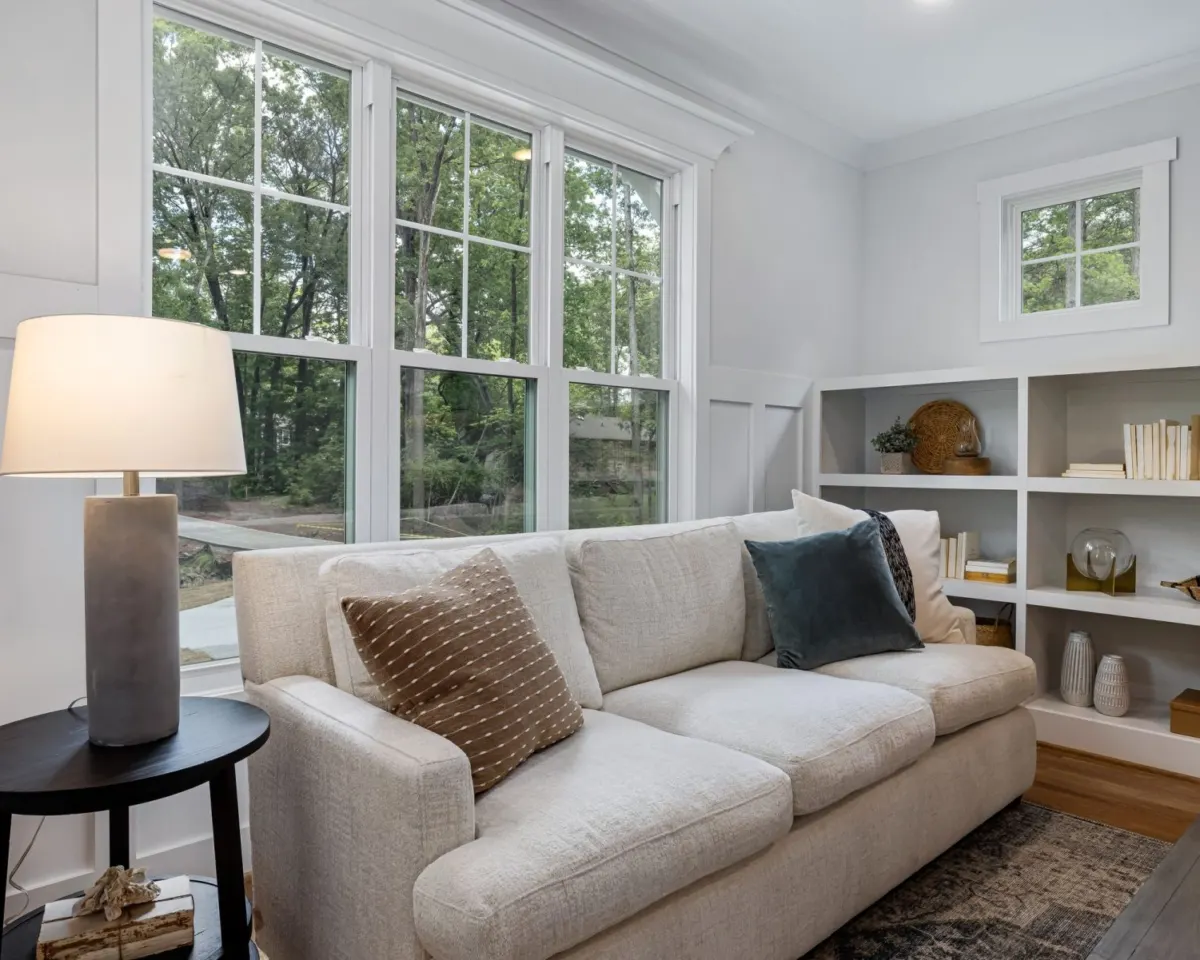 Bright living room with new white double-hung windows